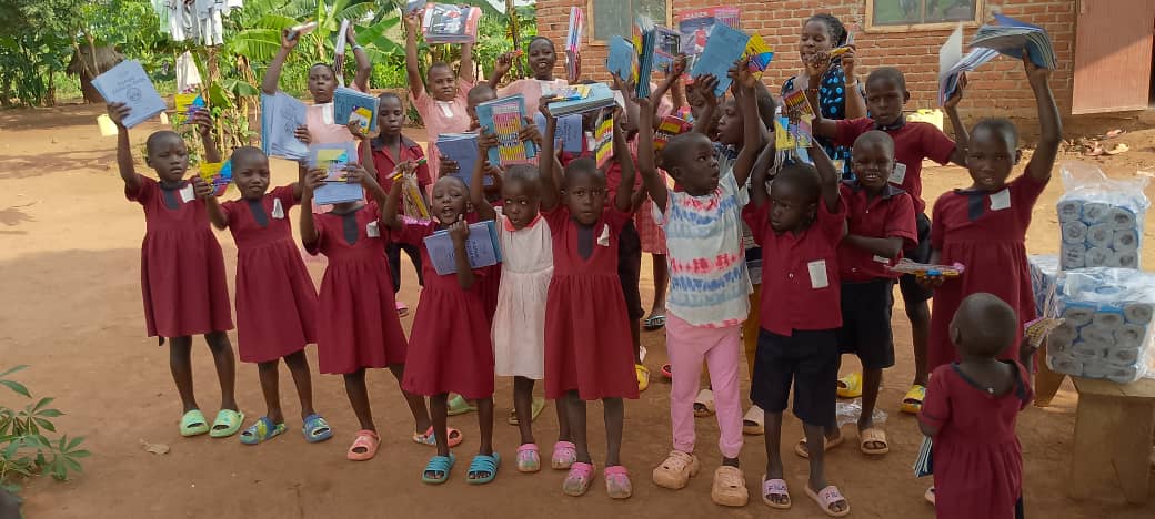 Children celebrating receiving school supplies